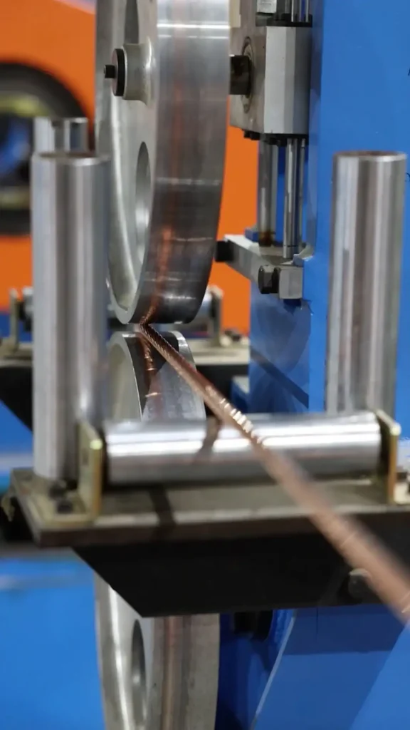 Copper wire undergoing extrusion process at Astro Cables.