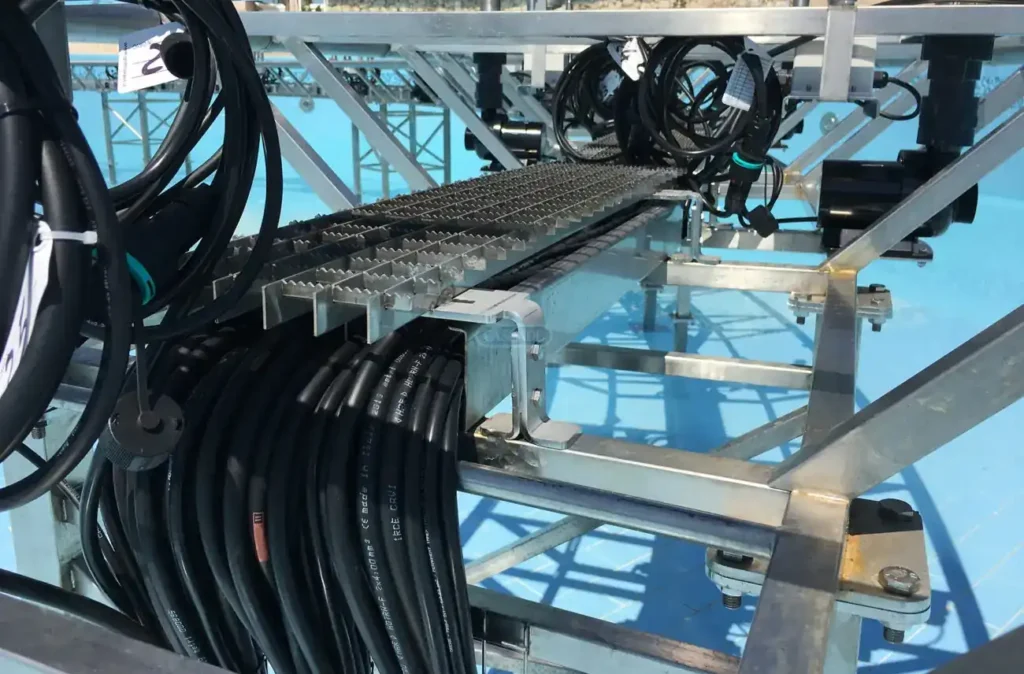 Astro Cables underwater cable installation process with cables on rack.