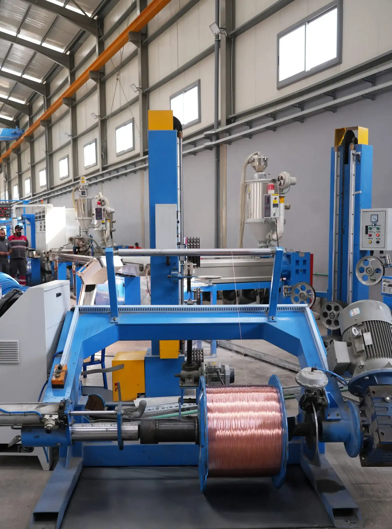 Wire production machine at Astro Cables processing copper wire.