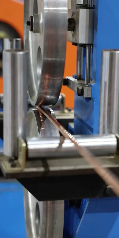 Copper wire undergoing extrusion process at Astro Cables.